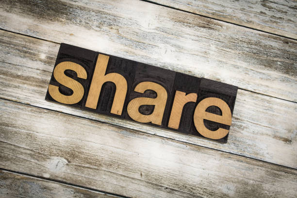 istock Share Letterpress Word on Wooden Background 696907608