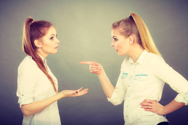istock Two girls having argument, interpersonal conflict 696912370