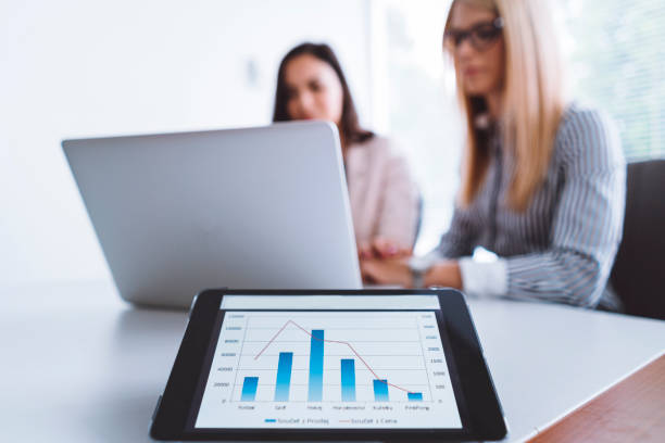 istock Two business colleagues working together in the office 696916510