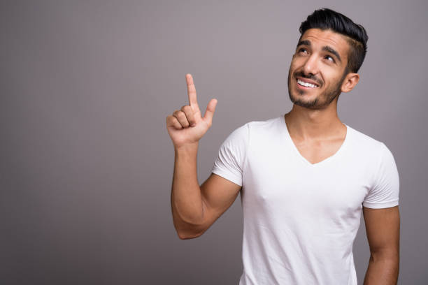 istock Studio shot of young handsome Persian man against gray background 696920376