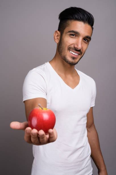 istock Studio shot of young handsome Persian man against gray background 696920698