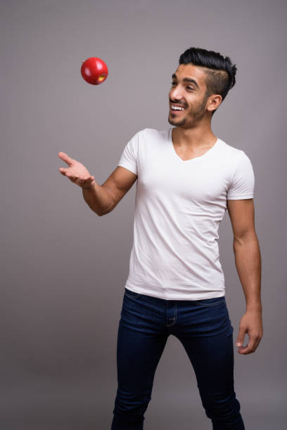 istock Studio shot of young handsome Persian man against gray background 696920862