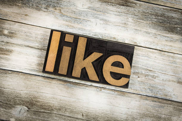 istock Like Letterpress Word on Wooden Background 696924690