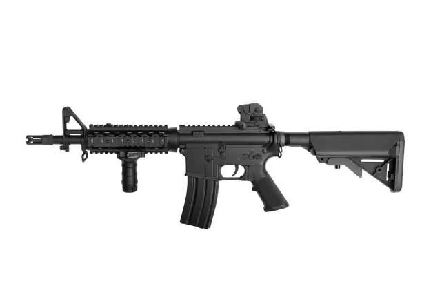 Photo of US Army weapon M4A1 carbine isolated on white background, Special forces rifle M4 with hand grip.