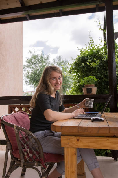 istock Online service, working at home by a young woman 696928736