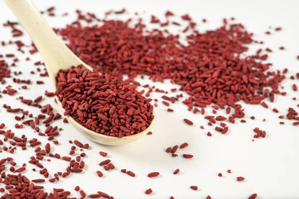 Red yeast rice Dried fermented red yeast rice as one of the oriental natural food coloring ingredient yeast stock pictures, royalty-free photos & images