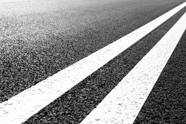 istock Asphalt road with marking lines white stripes 696932518
