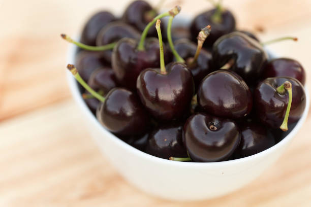 istock White bolw  with ripe cherries 696932564