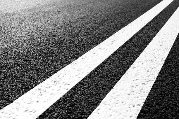 istock Asphalt road with marking lines white stripes 696932682