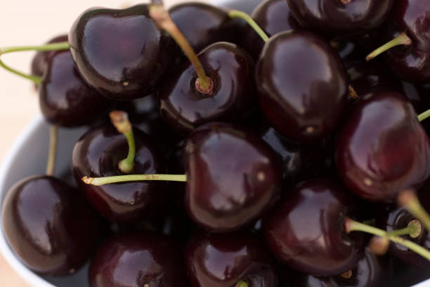 istock White bolw  with ripe cherries 696932820