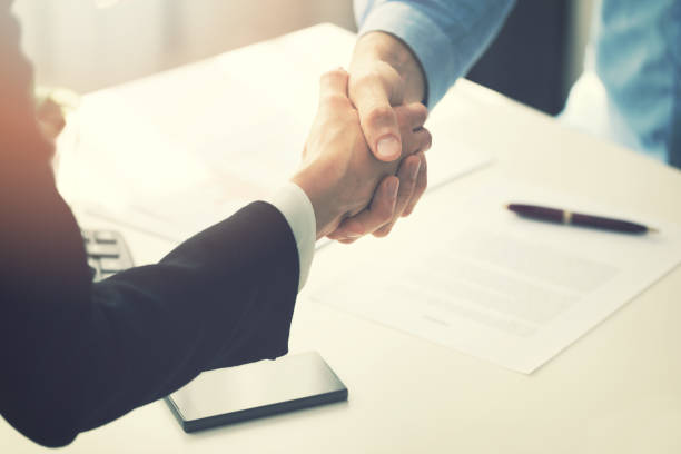 istock business people handshake after partnership contract signing 696935188
