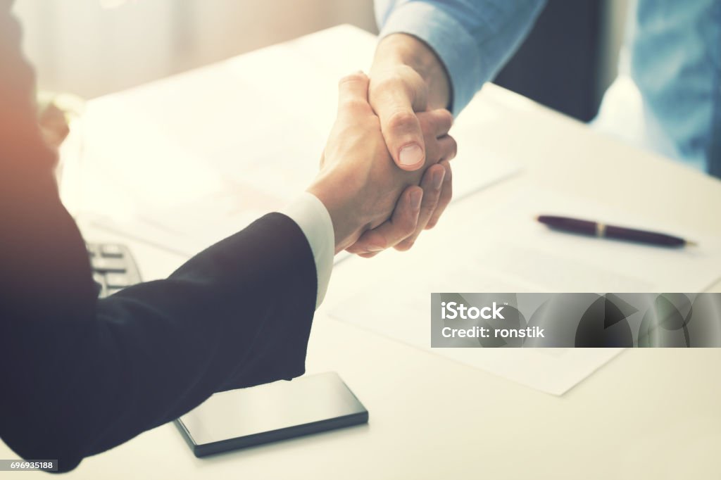 business people handshake after partnership contract signing Contract Stock Photo