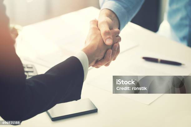 Business People Handshake After Partnership Contract Signing Stock Photo - Download Image Now