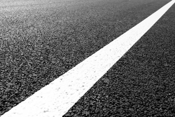 istock Asphalt road with marking lines white stripes 696935330