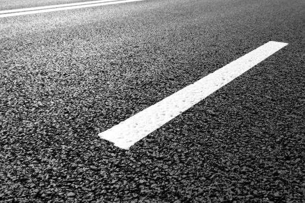 istock Asphalt road with marking lines white stripes 696935472