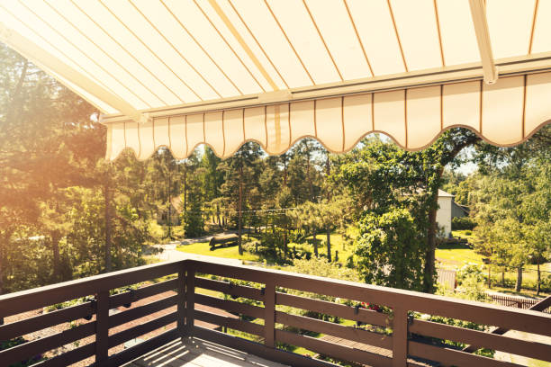 awning over balcony terrace on sunny day - toldo objeto manufaturado imagens e fotografias de stock