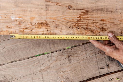 Measure the Length of Wooden Plank with Type Measure