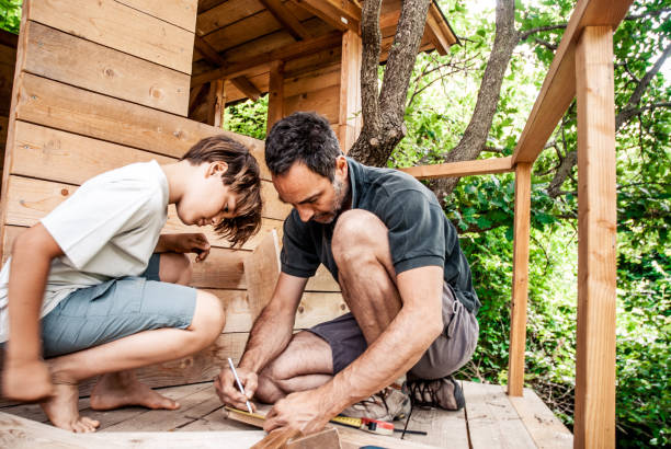 Father and son building a tree house together