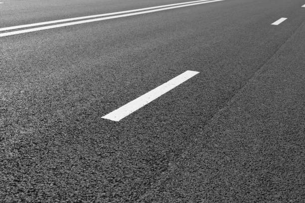 istock Asphalt road with marking lines white stripes 696936022