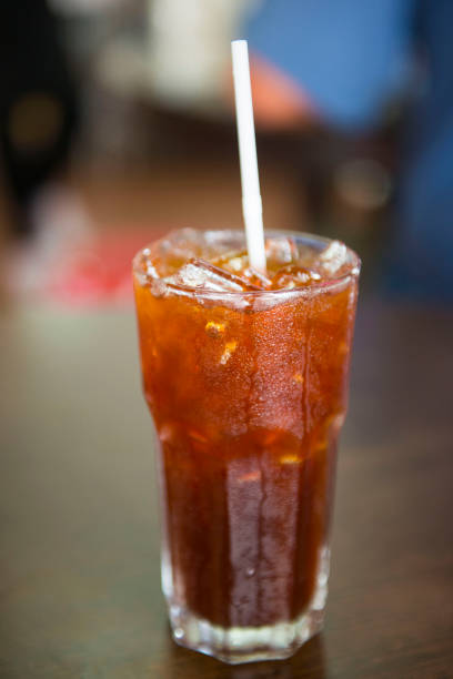 istock Thai black tea with ice in glass 696936040