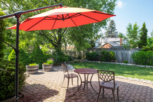 istock Backyard Garden with Bright Orange Cantilever Umbrella 696939860
