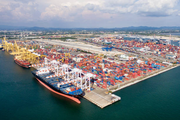 istock Aerial view of cargo ships loading containers at seaport. 696940148