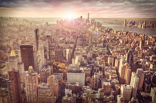 istock New York city skyline, sunrise in background. 696944362
