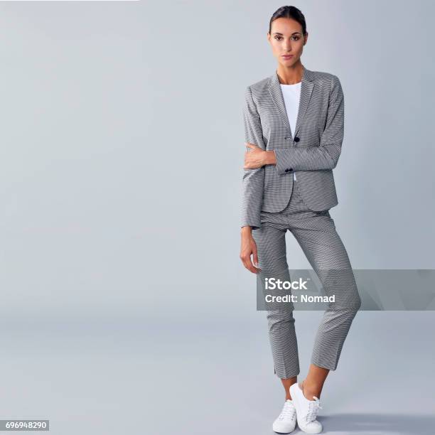Full Length Of Confident Businesswoman Holding Arm Stock Photo - Download Image Now - Women, One Woman Only, Full Length
