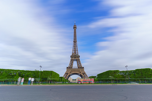 PARIS , FRANCE - MAY 13 , 2017 : Atmosphere around The famous Eiffel Tower in the morning