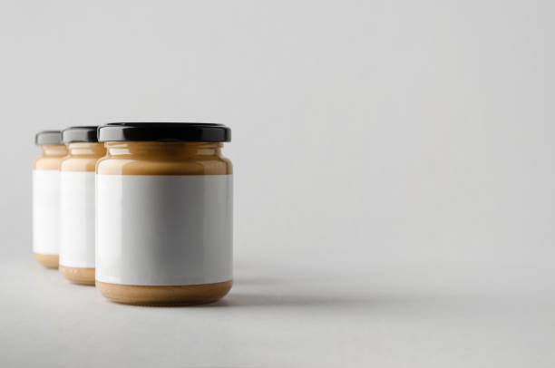 istock Peanut / Almond / Nut Butter Jar Mock-Up - Three Jars. Blank Label 696955370