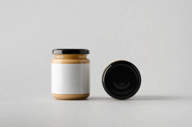 istock Peanut / Almond / Nut Butter Jar Mock-Up - Two Jars. Blank Label 696955496
