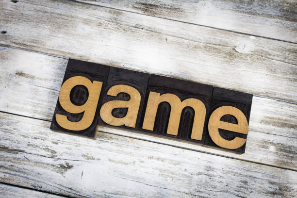 istock Game Letterpress Word on Wooden Background 696958980