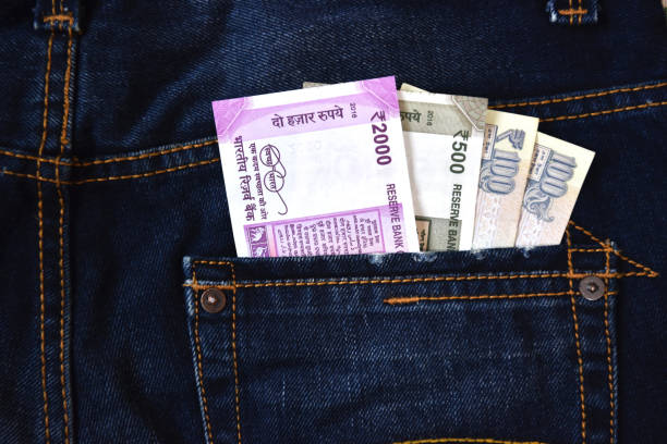 istock Money in jeans back pocket 696966574