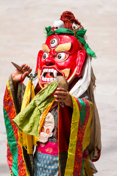 Unidentified monk with phurpa (ritual knife) performs a religious masked and costumed mystery dance of Tibetan Buddhism during the Cham Dance Festival Hemis, India - June 29, 2012: unidentified monk with phurpa (ritual knife) performs a religious masked and costumed mystery dance of Tibetan Buddhism during the Cham Dance Festival in Hemis monastery, India. cham mask stock pictures, royalty-free photos & images