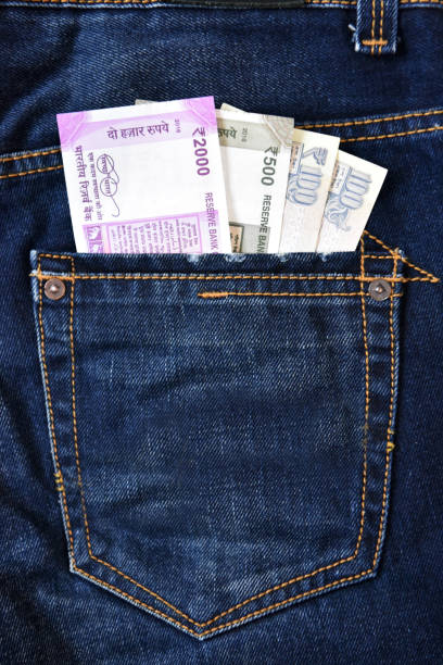istock Money in jeans back pocket 696966646