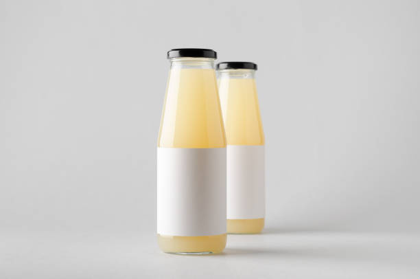 istock Juice Bottle Mock-Up - Two Bottles. Blank Label 696967060