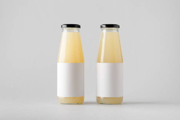 istock Juice Bottle Mock-Up - Two Bottles. Blank Label 696967120
