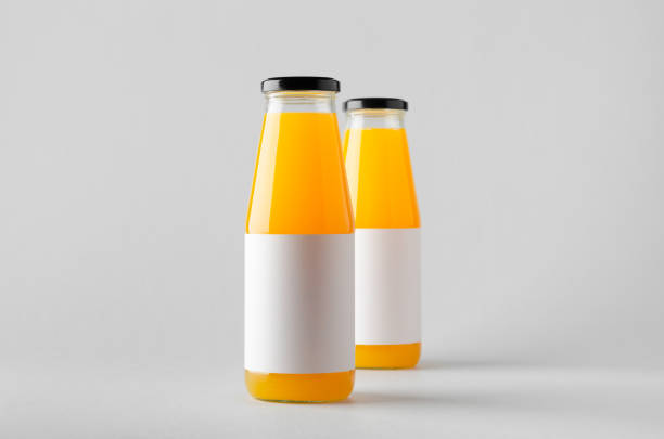 istock Juice Bottle Mock-Up - Two Bottles. Blank Label 696967582