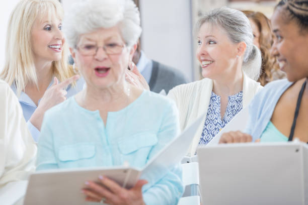 istock Senior adults attend seminar or conference 696977710
