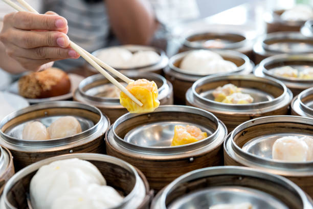istock Chinese streamed dumpling in bamboo basket on table in Chinese restaurant. 696977736