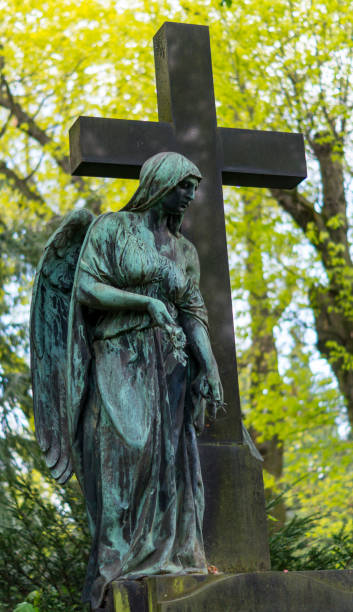 istock Statue of an Angel on Graveyard 696978326