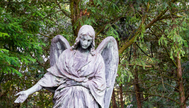 istock Statue of an Angel on Graveyard 696978362