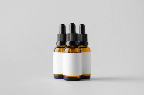 istock Dropper Bottle Mock-Up - Three Bottles. Blank Label 696978942