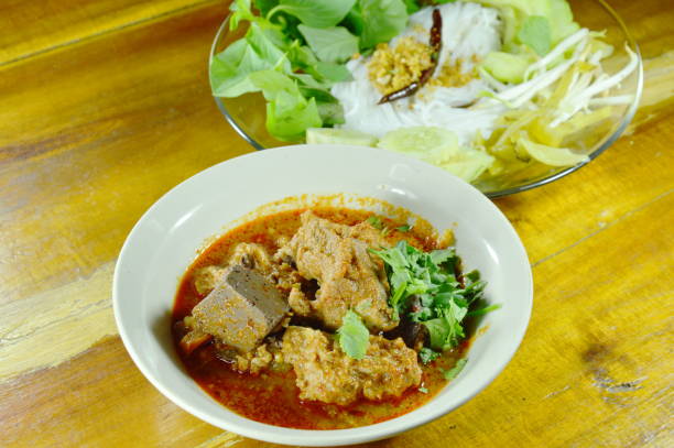 istock rice noodles and vegetable with spicy minced pork and bone red cotton tree sauce 696985672