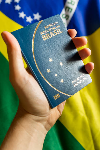 istock Hand holding Brazilian Passport 696985754