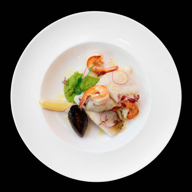 istock Fish fillet with seafood, isolated on black 696988216