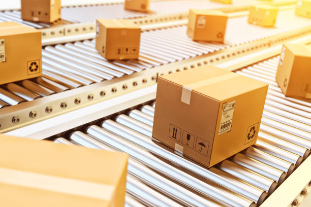 packages delivery, packaging service and parcels transportation system concept - conveyor belt fotos imagens e fotografias de stock
