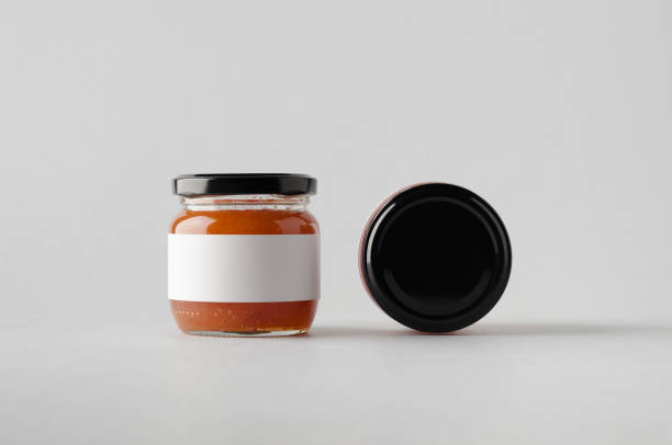 istock Quince Jam Jar Mock-Up - Two Jars. Blank Label 696994850