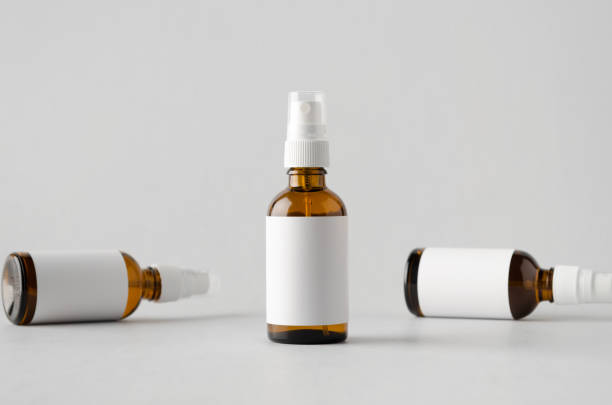 istock Amber Spray Bottle Mock-Up - Three Bottles. Blank Label 697007978