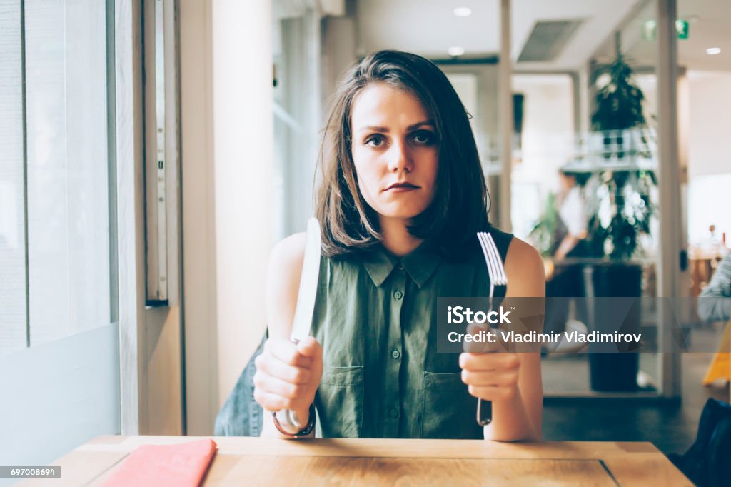 Woman in a restaurant Woman waiting for her meal Hungry Stock Photo